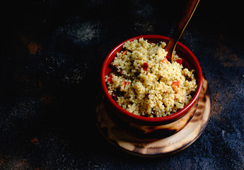 Tabule. Arabian vegetarian salad with couscous. Dark background. Isolated