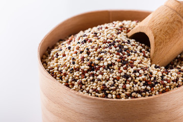mix of quinoa grains on white acrylic background