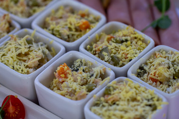 Mini portions of traditional russian salad Olivier, close up.