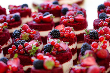 Red velvet mini cakes with blackberry close up