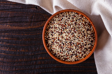 mix of quinoa grains on dark wooden rustic background