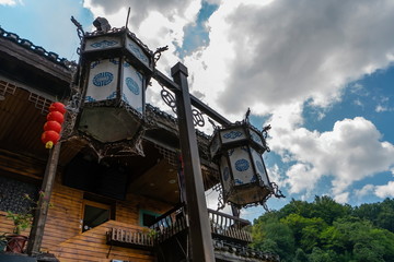 Pole holding old Chinese lanterns that lit the streets long ago. Fenghuang Ancient Town, Hunan province, China