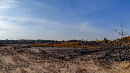 Abandoned and flooded quarry for coal mining. Horizontal photo