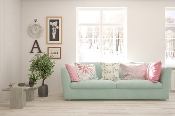 Stylish room in white color with sofa and winter landscape in window. Scandinavian interior design. 3D illustration