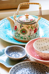 Collection of decorative tableware on the table