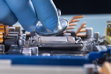 Scientist or doctor working with a computer motherboard