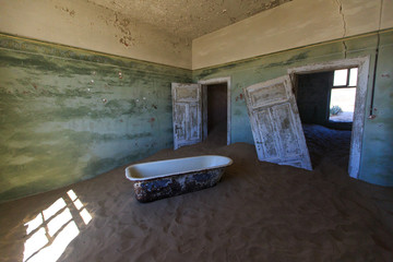 Abandoned and forgotten building and room left by people and being taken over by encroaching...