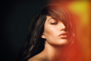 Portrait of  beautiful young caucasian brunette woman model with healthy hair.