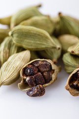 fragrant green cardamom on a white acrylic background