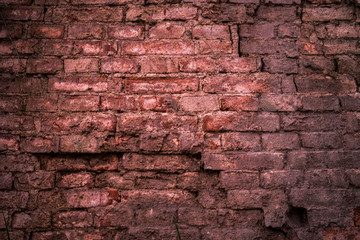 Old brick wall texture for background. Ancient building wall. Wall of destroyed buildings. Rustic wall, vintage background.