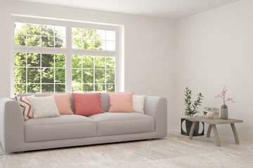 Stylish room in white color with sofa and summer landscape in window. Scandinavian interior design. 3D illustration