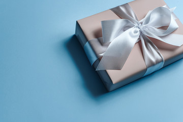 Pink gift box on a blue background.