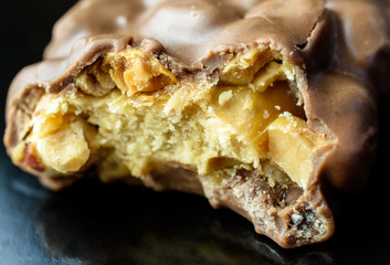 closeup of candy bar with bite taken out