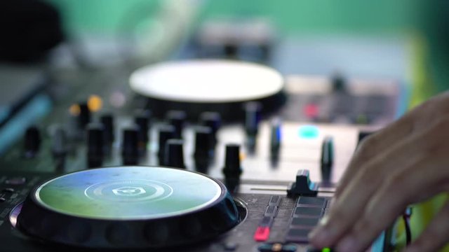 DJ playing music in club house