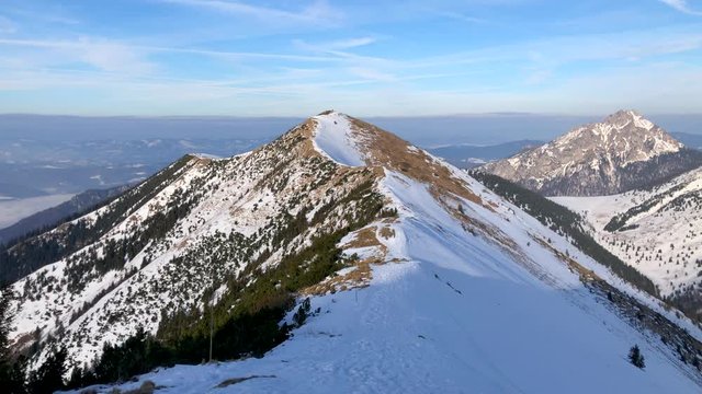 Winter Mountain Landscape At A Sunny Day With Fog In The Valleys close to Chleb mountain, Snilovske sedlo, Mala Fatra, Slovakia, 4k footage video