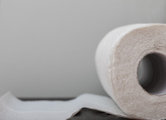 Paper white towels on a gray background. Copy space, flat lay.