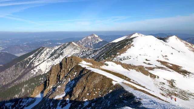 Winter Mountain Landscape At A Sunny Day With Fog In The Valleys close to Chleb mountain, Snilovske sedlo, Mala Fatra, Slovakia, 4k footage video