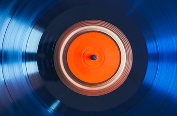 Close up of turntable play blue vinyl record