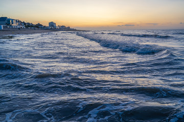Obraz premium Langrune-Sur-Mer, France - 08 15 2019: Beautiful sunset on the beach