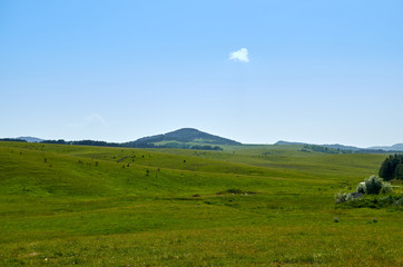 Idyllic Serbian mountain landscape - with hills and fields - in spring