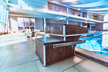 Starting block in a swimming pool during the sports competition