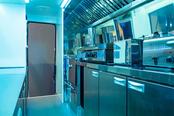 The mobile kitchen. Mobile restaurant. Compact mobile kitchen. Stainless steel kitchen appliances. Cooking equipment. Public catering establishment. Cafe. Restaurant.
