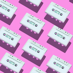 Audio cassette pattern on colored background. Audio cassette tape. Vintage disco poster. Pattern of audio cassetes