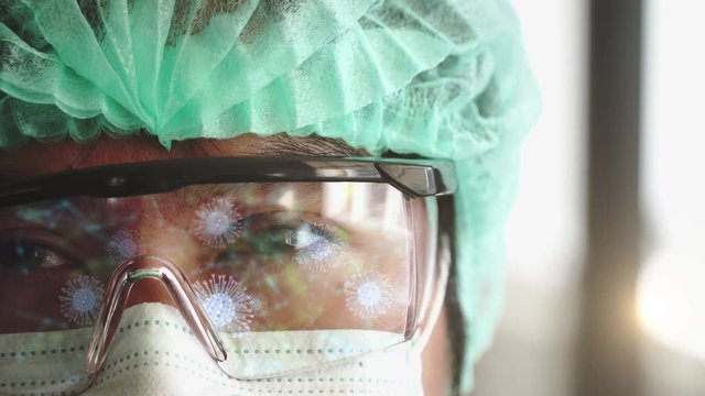 Medical lab worker analyzing Coronavirus - viruses of the Corona family rotating and moving  as dangerous flu strain cases as a pandemic medical health risk concept  - Powered by Adobe