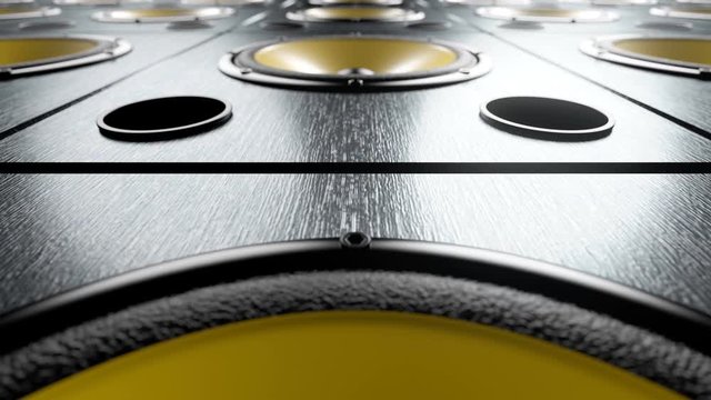 Camera moving over audio speakers with yellow reflective membranes dancing and vibrating while playing modern music at 90 bpm frequency. Seamless loop. Dance or rock party music concept idea.