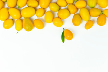 kumquat and orange on a wooden board. Fresh fruits, food on a white background.