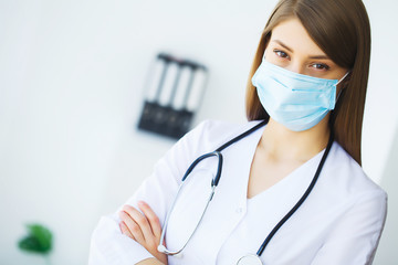 Portrait of young doctor standing in medical office