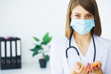 Portrait of young doctor standing in medical office