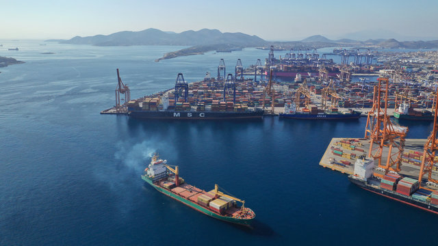 Aerial photo of industrial cargo container terminal in Perama and Drapetsona commercial port near Piraeus, Attica, Greece