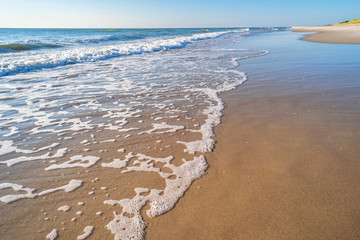 azure sea waves under a blue sky sunny summer day
