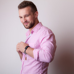 Handsome young elegant man studio portrait.