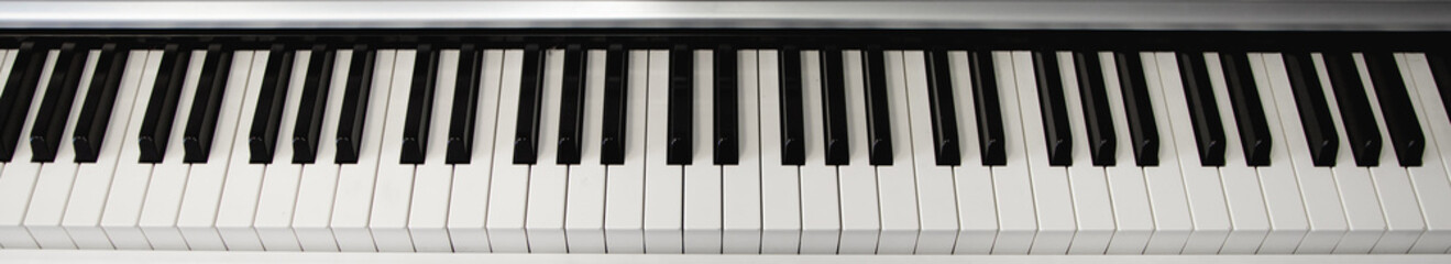 Naklejka premium top view piano keyboard black and white