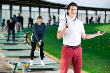 Male golf player is ready for game