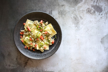 Spinach Ricotta Ravioli with Sausage and Tomatoes