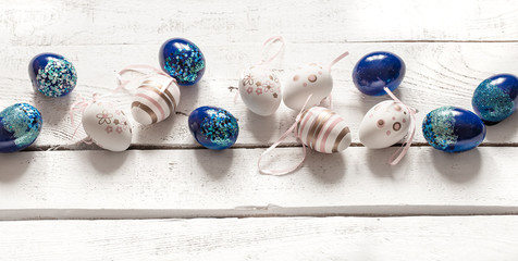 Stylish beautiful composition with blue Easter eggs.