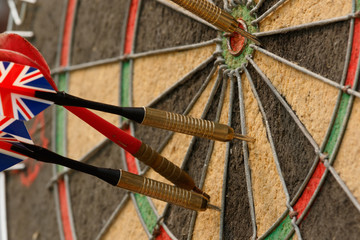 close up of darts on a dartboard