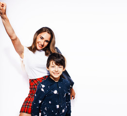 lifestyle and people concept, little cute boy with teenage girl posing together cheerful happy smiling isolated on white background