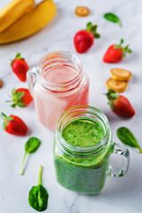 Spinach banana and strawberry smoothies in glass