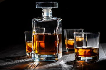 a glass of whiskey with ice