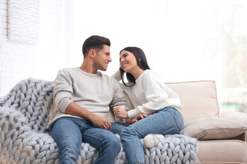 Happy couple spending time together at home. Winter vacation