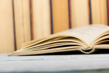 Open book, hardback books on wooden table. Back to school. Copy space