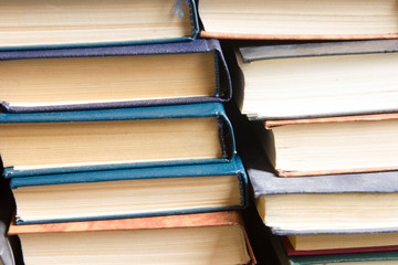 Stack of books background. many books piles.