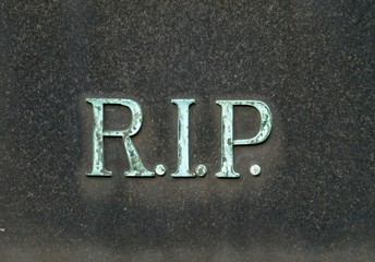 bronze letters saying R.I.P