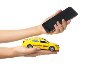 Woman with taxi car model and smartphone on white background, closeup. Space for design