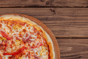 Pizza with Mozzarella cheese, salami, Tomatoes, pepper, Spices. Italian pizza