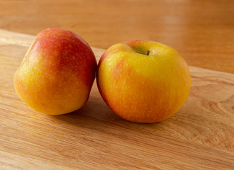 Red apples close up on a wooden background
